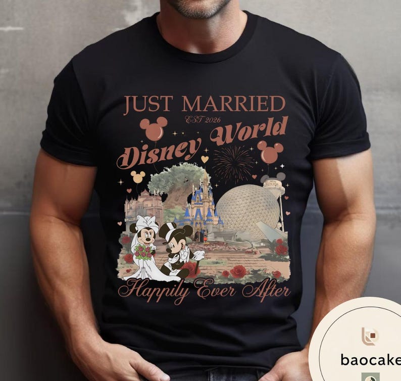 May include: Black t-shirt featuring a graphic of Mickey and Minnie Mouse in wedding attire in front of Disney World landmarks. Text reads "JUST MARRIED EST 2026 Disney World Happily Ever After."