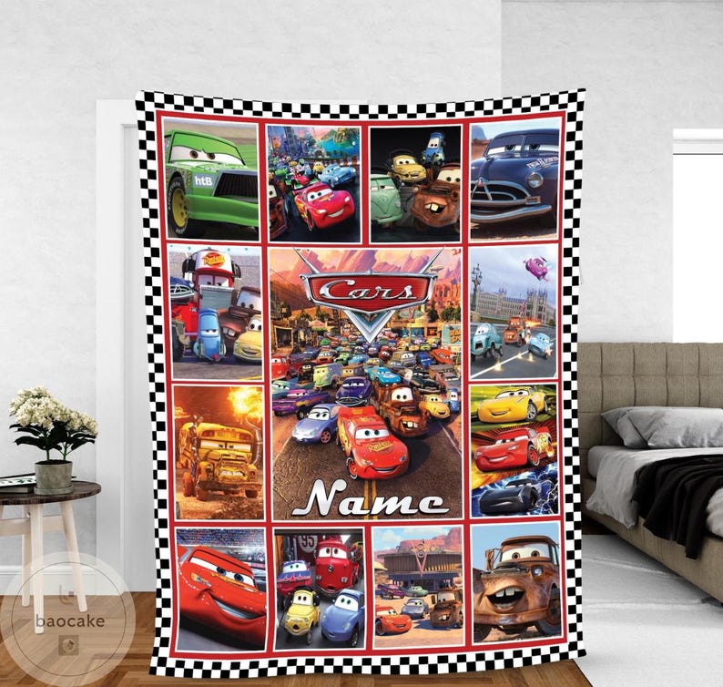 May include: A rectangular fleece blanket featuring a collage of characters from the movie Cars, framed by a black and white checkered border. The center panel displays the Cars logo above the word Name, surrounded by various animated vehicle scenes.