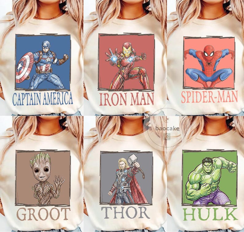 May include: Cream-colored sweatshirts featuring six different Marvel superheroes: Captain America, Iron Man, Spider-Man, Groot, Thor, and Hulk. Each superhero is depicted in a square frame with their name below. The designs are in a cartoon style.