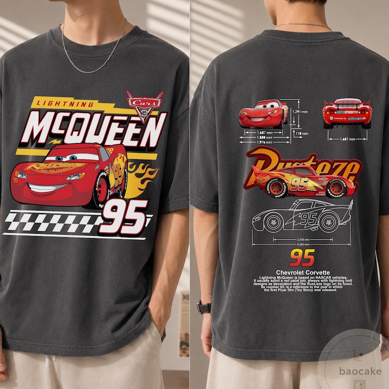 May include: A charcoal grey t-shirt featuring a graphic of Lightning McQueen on the front with the text Lightning McQueen and 95. The back displays technical diagrams of the car, the Rust-eze logo, and text detailing Chevrolet Corvette.