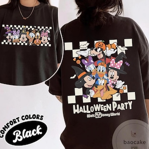 May include: Black Comfort Colors t-shirt featuring a Halloween-themed graphic of Disney characters. The front and back of the shirt display a colorful design with Mickey Mouse, Minnie Mouse, Donald Duck, and Goofy in Halloween costumes. The text "HALLOWEEN PARTY" is also visible.