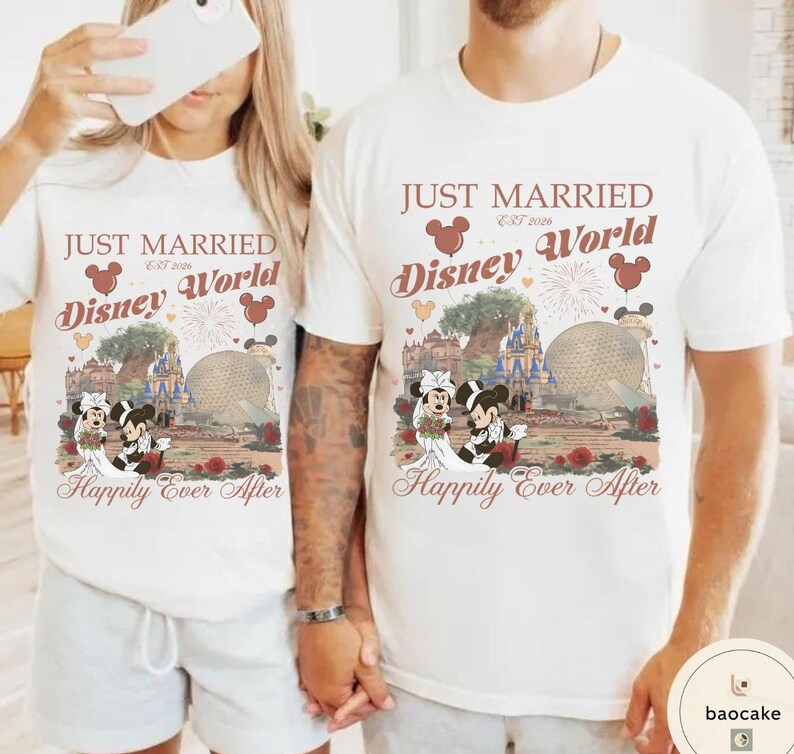 May include: Matching white t-shirts with a Disney World theme. The shirts feature the text "JUST MARRIED Disney World" with Mickey and Minnie Mouse in wedding attire, along with the phrase "Happily Ever After."