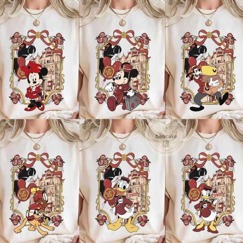 May include: Cream-colored t-shirts featuring various Disney characters in a framed design. Each design includes a character like Minnie Mouse, Mickey Mouse, Goofy, Pluto, or Donald Duck, with a building and floral accents. The designs are in shades of red, gold, and black.