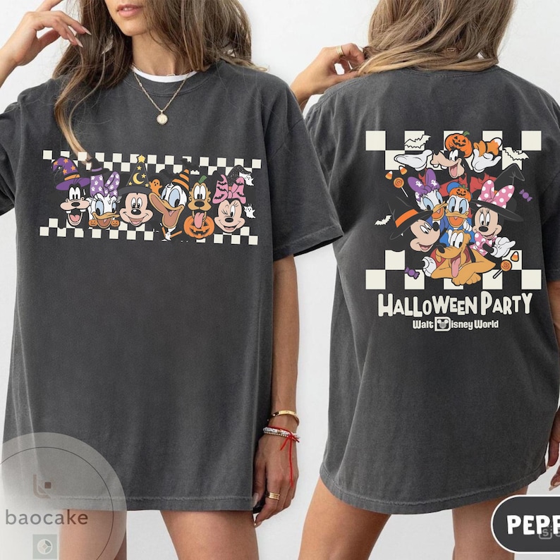 May include: Dark gray t-shirt featuring a Halloween-themed graphic with Disney characters. The front design includes Mickey, Minnie, Donald, and Goofy in costumes. The back of the shirt has the text "Halloween Party" and more characters.