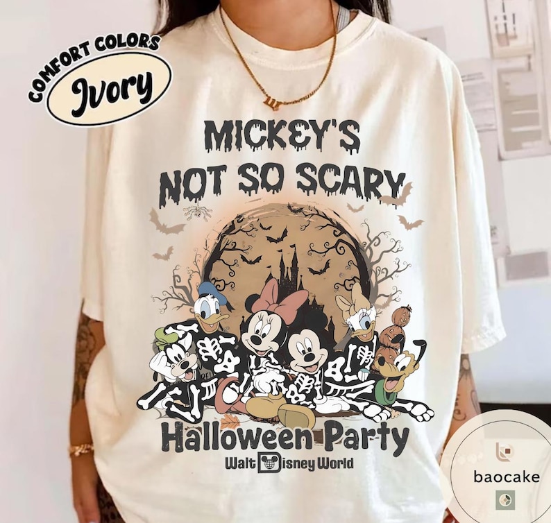 May include: Ivory-colored t-shirt with the text "Mickey's Not So Scary Halloween Party" and a graphic of Disney characters in skeleton costumes. The design includes bats, a castle, and the Walt Disney World logo.