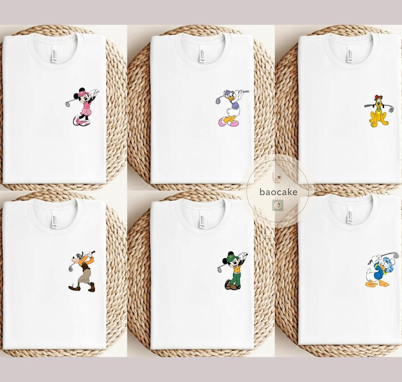 May include: White t-shirts with various cartoon characters playing golf. Characters include Minnie Mouse, Donald Duck, Pluto, Goofy, and Mickey Mouse. Each shirt features a small, colorful graphic on the chest.