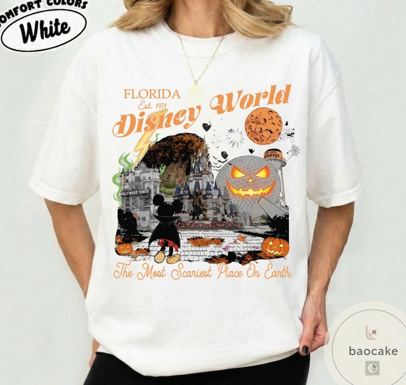 May include: White t-shirt with a Halloween-themed graphic featuring the text "Florida Disney World" and a spooky design. The graphic includes a jack-o'-lantern, Mickey Mouse, and the phrase "The Most Scariest Place On Earth."