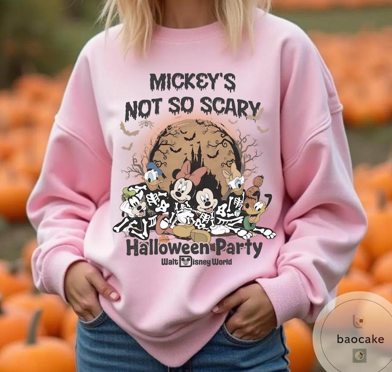 May include: A light pink sweatshirt with the text "Mickey's Not So Scary Halloween Party" and Disney characters in skeleton costumes. The graphic includes Mickey, Minnie, Donald, Daisy, Goofy, and Pluto. The Walt Disney World logo is at the bottom.