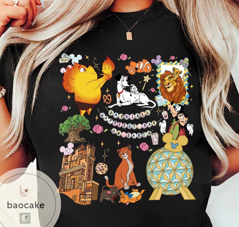 May include: Black t-shirt featuring a colorful graphic of various Disney characters, including Simba, Dumbo, and Dalmatian dogs. The phrase "Happiest Dad on Earth" is also displayed. The shirt has a crew neck and short sleeves.