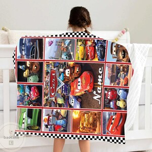 May include: A rectangular fleece blanket featuring a collage of scenes from the movie Cars, including Lightning McQueen and Mater. The design includes the Cars logo and a customizable Name section, all framed by a black and white checkered border.