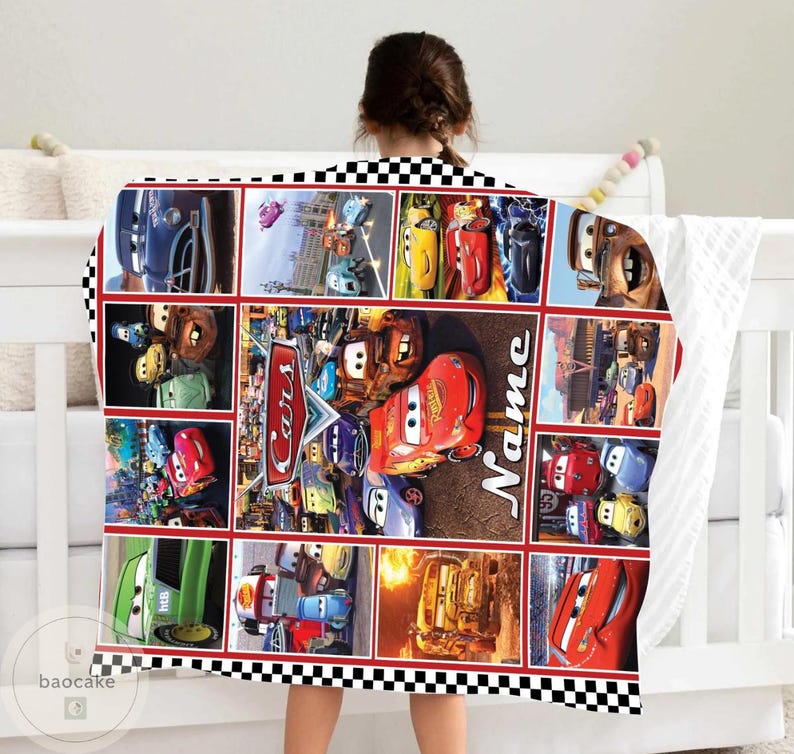 May include: A rectangular fleece blanket featuring a collage of scenes from the movie Cars, including Lightning McQueen and Mater. The design includes the Cars logo and a customizable Name section, all framed by a black and white checkered border.