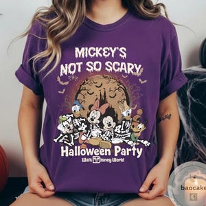 May include: A purple t-shirt with the text "Mickey's Not So Scary Halloween Party" and Disney characters in skeleton costumes. The design includes a full moon, bats, and a castle silhouette. Walt Disney World logo is at the bottom.