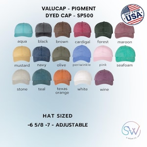 May include: A selection of pigment-dyed baseball caps in a range of colours, such as aqua, black, brown, and maroon. The hats are adjustable and sized from 6 5/8 to 7. The image also includes the text "VALUCAP - PIGMENT DYED CAP - SP500."