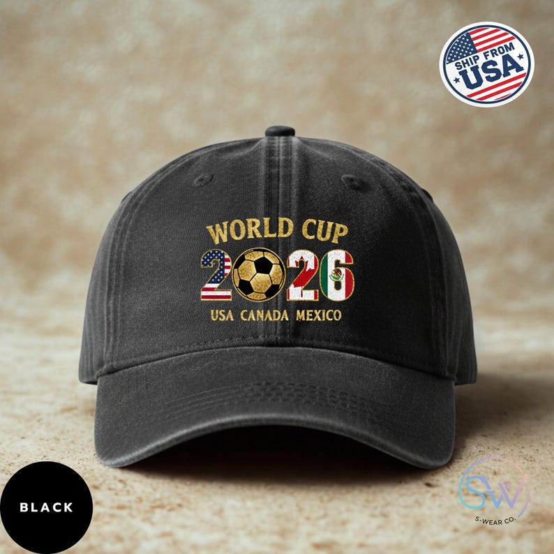 May include: Black baseball cap featuring "WORLD CUP 2026" text and a soccer ball graphic. The design includes the USA and Mexico flags, with "USA CANADA MEXICO" text. A "SHIP FROM USA" sticker is on the right.