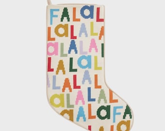 May include: Cream-colored Christmas stocking with the words "FALALALA" in various bright colors. The stocking has a loop for hanging and a cream-colored border.