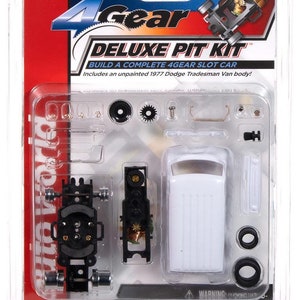 May include: A 4Gear Deluxe Pit Kit for building a slot car. The kit includes an unpainted 1977 Dodge Tradesman Van body, black wheels, and various small parts. The packaging is blue, red, and white.