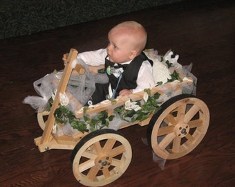 baby flower girl in wagon