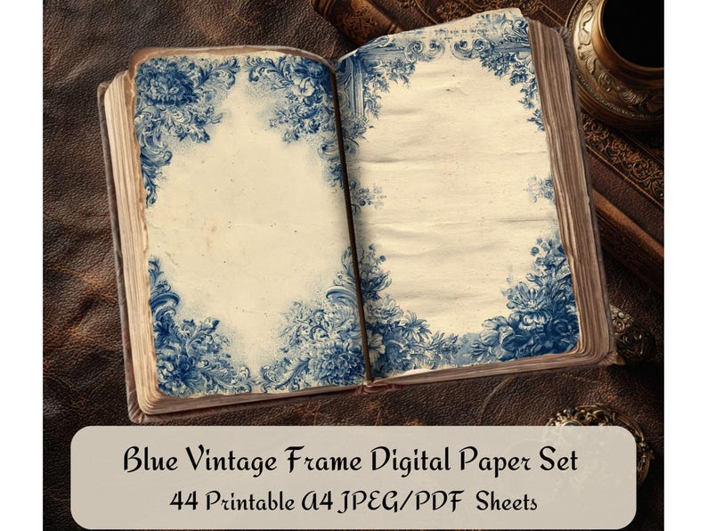 May include: An open book with aged, cream-colored pages, each bordered with intricate blue floral designs. The book is set on a leather surface, with the text "Blue Vintage Frame Digital Paper Set" and "44 Printable A4 JPEG/PDF Sheets" at the bottom.