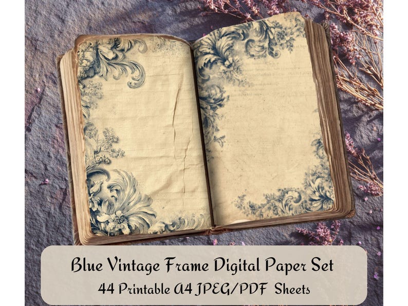 May include: An open book with aged, cream-colored pages and blue floral designs in the corners. The text "Blue Vintage Frame Digital Paper Set" is displayed on a rectangular label at the bottom, along with "44 Printable A4 JPEG/PDF Sheets."
