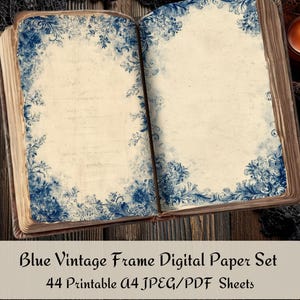 May include: An open book with aged pages, featuring blue floral frame designs. The text "Blue Vintage Frame Digital Paper Set" is displayed on a white rectangle at the bottom of the image. A lit candle sits in the background.