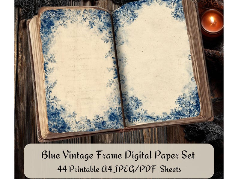 May include: An open book with aged pages, featuring blue floral frame designs. The text "Blue Vintage Frame Digital Paper Set" is displayed on a white rectangle at the bottom of the image. A lit candle sits in the background.