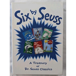 May include: A white hardcover book titled Six by Seuss, A Treasury of Dr. Seuss Classics. The cover features a blue starburst graphic containing six smaller book covers: And to Think That I Saw It on Mulberry Street, The 500 Hats, Horton Hatches the Egg, Yertle the Turtle, How the Grinch Stole Christmas, and The Lorax.