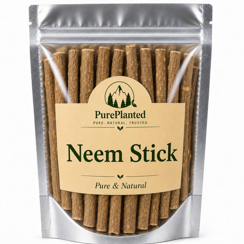 May include: A silver stand-up pouch filled with brown neem sticks. The label features a mountain logo, the text PurePlanted, PURE. NATURAL. TRUSTED., Neem Stick, and Pure & Natural. The sticks are cylindrical, woody, and textured in appearance.