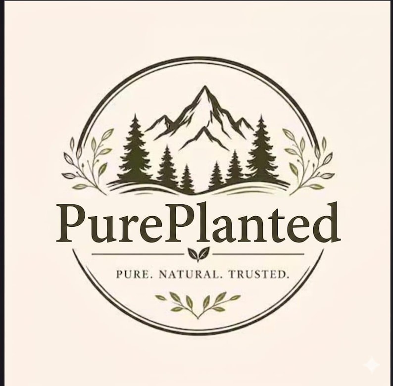 May include: A circular logo featuring a mountain range and pine trees in dark green. The text PurePlanted is centered, with the tagline PURE. NATURAL. TRUSTED. below. The design is framed by delicate leaf sprigs on a light cream background.