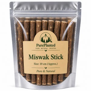 May include: A silver stand-up pouch containing multiple brown Miswak sticks. The label features the text PurePlanted, Miswak Stick, and Size: 10 cm (Approx.). The sticks have a textured, woody bark surface and are arranged vertically inside the clear plastic bag.
