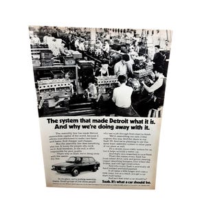May include: A black and white vintage advertisement for Saab featuring a car assembly factory floor with workers and engines. The text reads: The system that made Detroit what it is. And why we're doing away with it. Includes a Saab 99 car image.