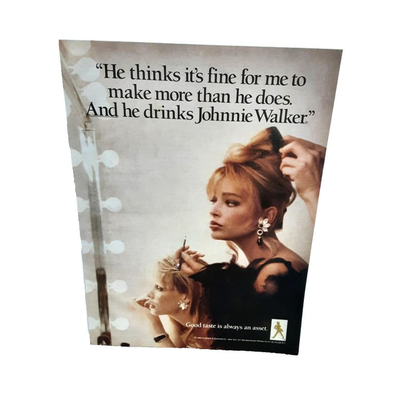 May include: Vintage advertisement featuring a woman with blonde hair, being styled. The text reads, "He thinks it's fine for me to make more than he does. And he drinks Johnnie Walker." The tagline is "Good taste is always an asset."
