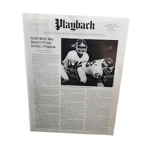 May include: A vintage newspaper clipping titled "Playback" with a black and white photo of two football players in action. The headline reads "Great White Way Doesn't Fit Into Simms's Playbook."