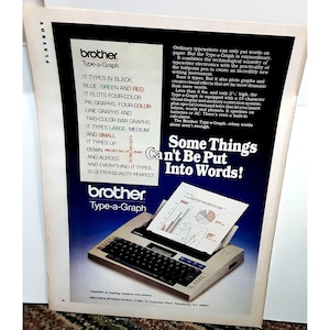 May include: A white Brother Type-a-Graph typewriter with a black keyboard and a sheet of paper with a graph and a pie chart in the paper tray. The text on the ad reads "Some Things Can't Be Put Into Words!" and "Brother Type-a-Graph".