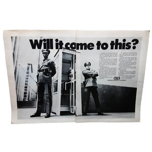 May include: A black and white photo of two men in uniform standing in front of a phone booth. The text "Will it come to this?" is printed in large, bold letters at the top of the image. The text "GTE" is printed in the bottom right corner of the image.