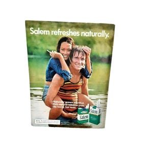 May include: A vintage advertisement for Salem cigarettes featuring a couple in a natural setting. The text reads "Salem refreshes naturally."  "Naturally grown menthol. Rich natural tobacco taste. No harsh, hot taste."  The ad also features a pack of Salem cigarettes.