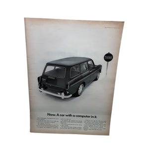 May include: Vintage advertisement featuring a black Volkswagen Squareback station wagon. The ad includes the text "Now. A car with a computer in it." A signpost with the word "THINK" is next to the car. The ad is printed on aged paper.