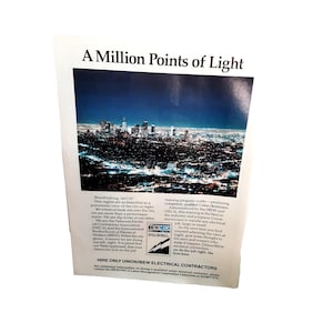 May include: A printed advertisement with the headline "A Million Points of Light" and a nighttime cityscape. The ad promotes Union/IBEW electrical contractors, highlighting their training program and expertise in handling electrical jobs.