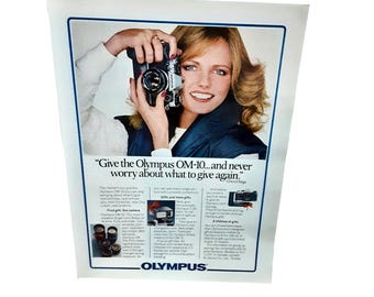 1981 Olympus OM10 Camera with Cheryl Tiegs Original Vintage print ad 80s