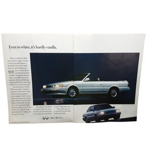 May include: An advertisement for the Infiniti M30 convertible. The image features a silver convertible car with the top down, set against a dark blue background. The text reads "Even in white, it's hardly vanilla."