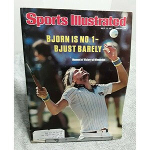 May include: Sports Illustrated magazine cover featuring a tennis player in mid-swing, with the headline "BJORN IS NO.1- BJUST BARELY" and the text "Moment of Victory at Wimbledon".