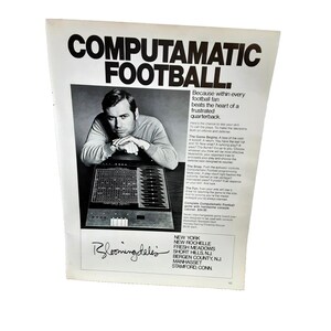 May include: Black and white advertisement for Computamatic Football, featuring a man leaning on a game console. The ad includes text about the game's features and the Bloomingdale's logo.