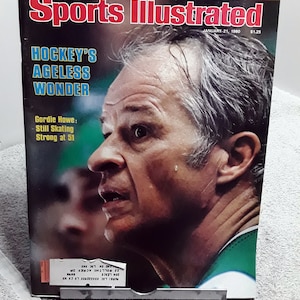 May include: Sports Illustrated magazine cover featuring Gordie Howe, a hockey player, with the headline "Hockey's Ageless Wonder". The cover is dated January 21, 1980.