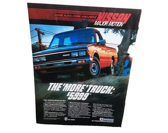 Anuncio impreso vintage de 1985 de una camioneta Nissan con caja regular, Major Motion, original de los años 80