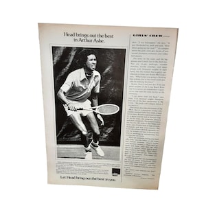 May include: A black and white photo of a man playing tennis. The man is wearing a white shirt and shorts. He is holding a tennis racket in his right hand. The text "Head brings out the best in Arthur Ashe." is printed at the top of the image.