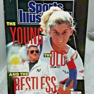 May include: Sports Illustrated magazine cover featuring a young woman in a white tennis outfit and a man in a red and white golf shirt. The cover text reads "The Young and the Restless" with "Monica Wins" and "Jack Wins" below the images. The magazine cover is dated June 18, 1990.