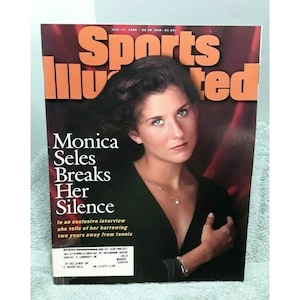 May include: Sports Illustrated magazine cover featuring tennis player Monica Seles with the headline "Monica Seles Breaks Her Silence". The cover is red and features a close-up portrait of Seles.