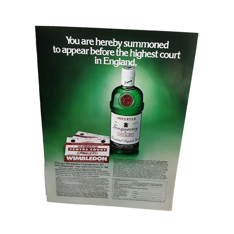 May include: A vintage advertisement for Tanqueray gin featuring a bottle of gin and tickets to Wimbledon. The text reads "You are hereby summoned to appear before the highest court in England. Pick the Wimbledon Champions in '87 and Tanqueray may send you there in '88."