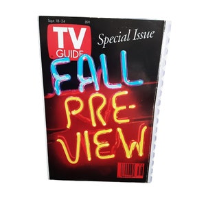 May include: A TV Guide magazine with a red, white, and blue logo and the text "FALL PREVIEW" in neon-style lettering. The cover is black with a red gradient background. The magazine is dated September 18-24.