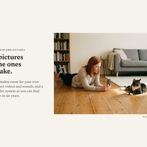The pictures are the ones you take: a woman on the floor photographing her cat with a phone