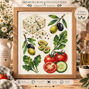 Może przedstawiać: Oprawiony wzór do haftu krzyżykowego z kulinarną ilustracją sera feta, zielonych i czarnych oliwek na gałązkach, świeżych zielonych liści, czerwonych pomidorów i pokrojonego ogórka. Tekst zawiera PREMIUM CROSS STITCH PATTERN, Digital PDF Pattern, 3 Sizes Included, Instant PDF Download, Color + Symbol Charts, Beginner Friendly, Printable Pattern oraz KopiluwakDesign.